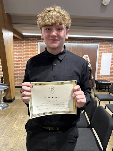 Paul Antonelli holding his certificate shortly after receiving it.