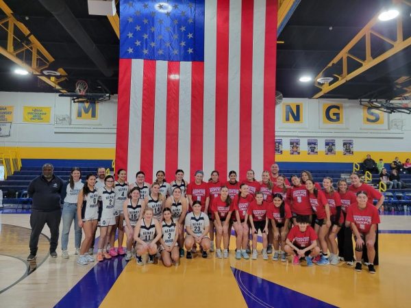 Manville’s girl basketball team with their opponent, Henry Hudson.